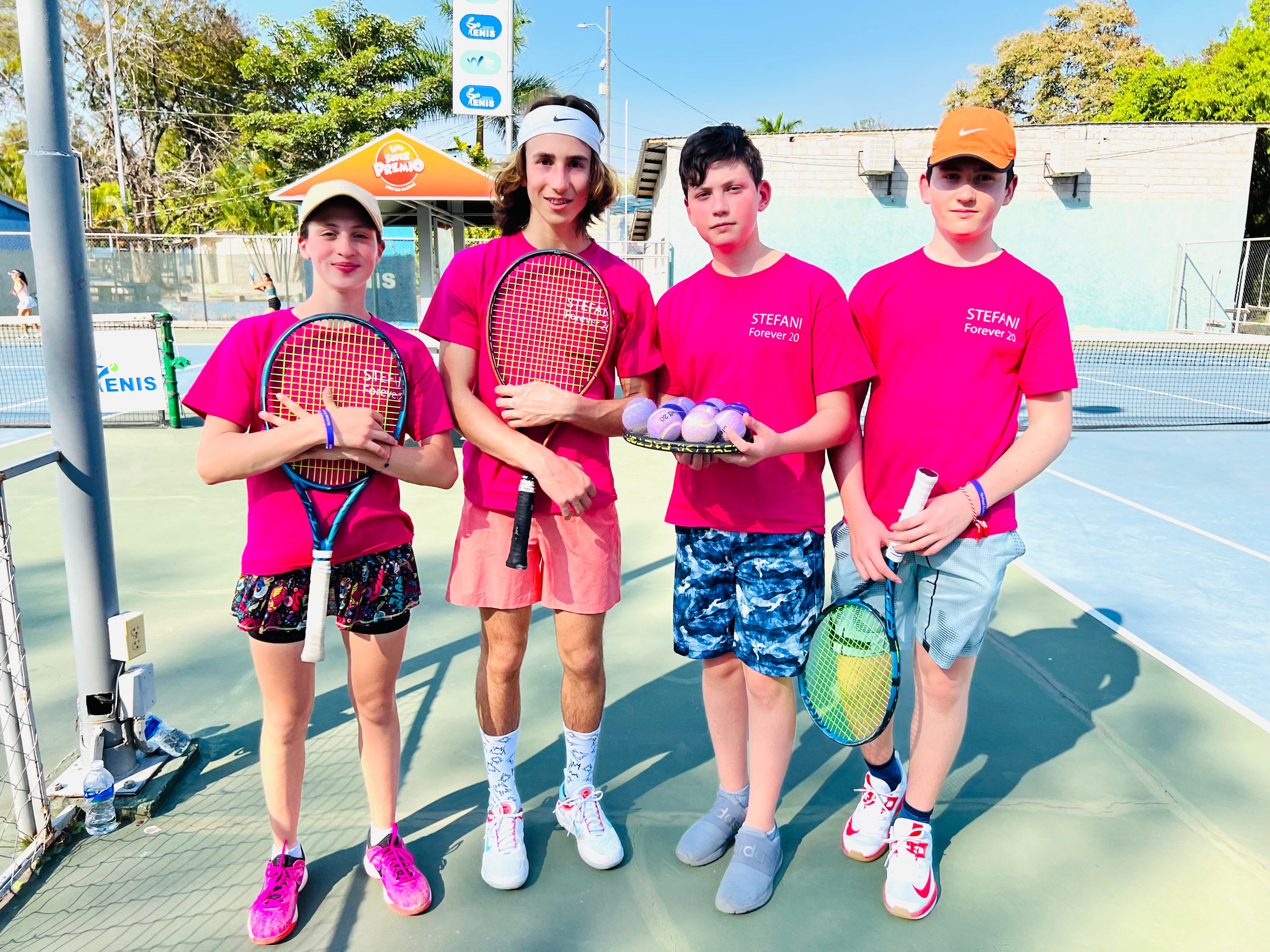 Foundation team on the tennis court in Honduras